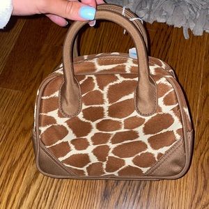 Mini giraffe print purse